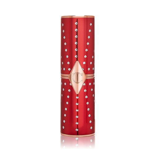 A closed lipstick in a red and gold-coloured tube with rhinestones studded all over. 