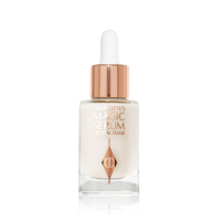 A travel-size, pearlescent serum in a glass bottle with a white rose gold coloured dropper lid. 