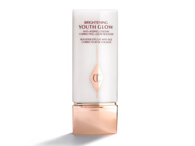 A brightening primer in a white-coloured rectangular bottle with a rose-gold coloured square-shaped lid. 