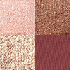 Swatches of a quad eyeshadow palette in rose gold, dark brown, champagne gold, and dark maroon. 