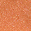 Close-up swatch of a sheer gold, glittery lip gloss.
