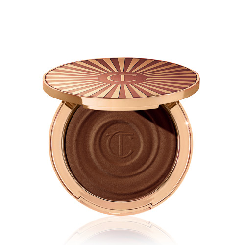 Open, cream bronzer compact in a black-brown shade with gold-coloured packaging.