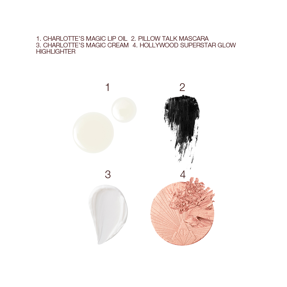 Swatches of luminous serum drops, black-coloured mascara, pearly-white face cream, and rose gold highlighter blush.