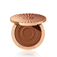 Open, cream bronzer compact in a dark-brown shade with gold-coloured packaging.