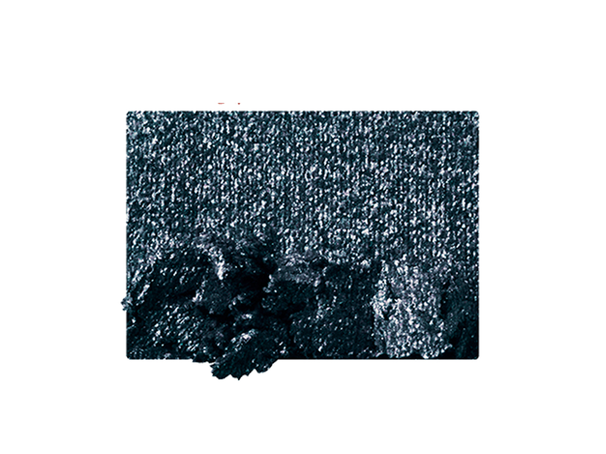 Swatch of a shimmery dark navy powder eyeshadow.