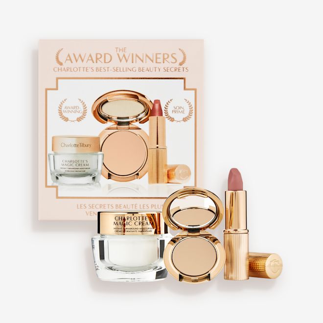 Makeup Starter Kit in Medium displayed Pearly-white face cream in a glass jar with a gold-coloured lid, pressed powder compact in a medium-shade, and a dusky pink lipstick in a sleek gold-coloured tube.