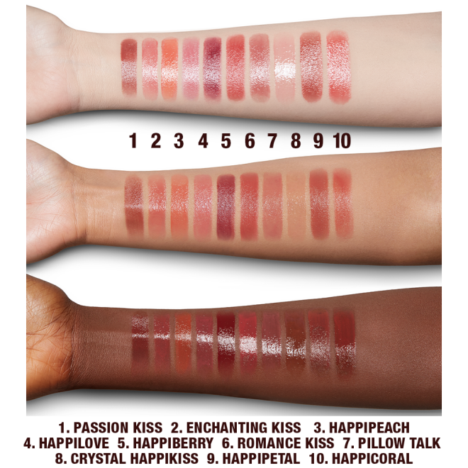 Fair, tan, and deep-tone arms with swatches of moisturising lipstick lip balms in ten shades, that are soft brown, nude peach, vibrant coral, soft pink, nude berry pink, berry-rose, medium-pink, sheer pink, wine, and bright coral.