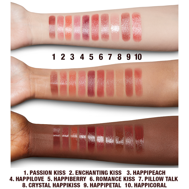 Happikiss Lipstick arm swatches Fair, tan, and deep-tone arms with swatches of moisturising lipstick lip balms in ten shades, that are soft brown, nude peach, vibrant coral, soft pink, nude berry pink, berry-rose, medium-pink, sheer pink, wine, and bright coral.