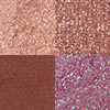 Swatches of four eyeshadows in matte and shimmery shades of peachy-pink, dusky rose, warm burgundy, and teal blue-brown