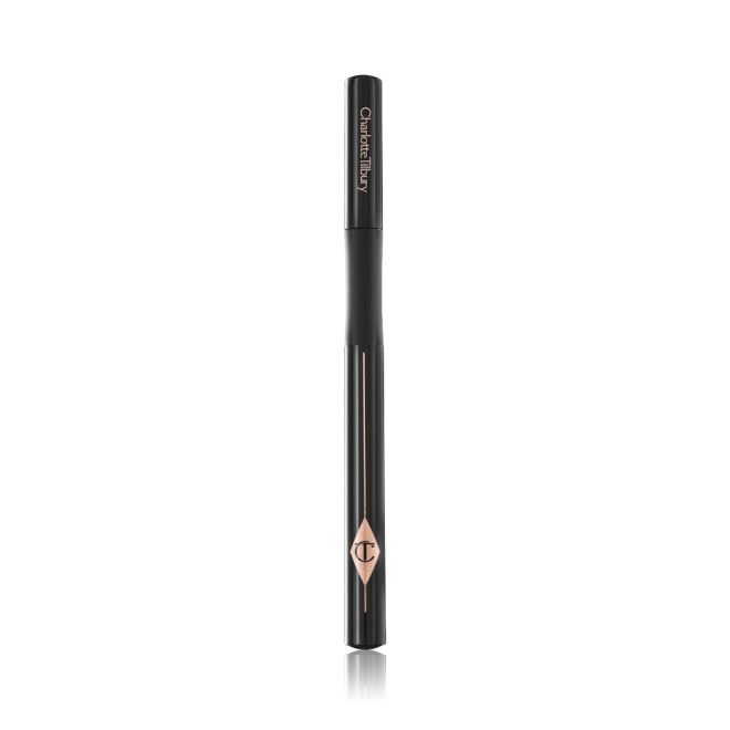 A closed eyeliner pen in jet-black packaging with the iconic CT logo embossed on it. 