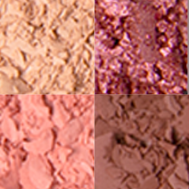 Close-up swatches of four eyeshadows in matte and shimmery shades of golden, peach, magenta, and brown.