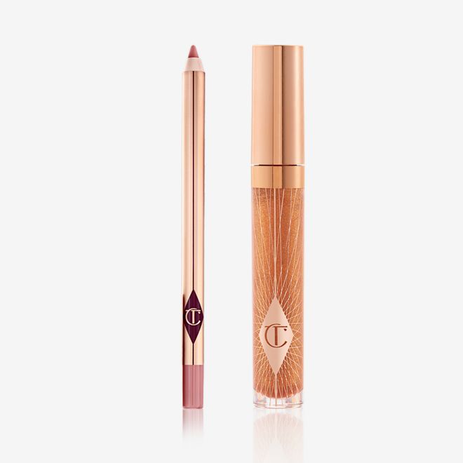 Lip Gloss and Lip Liner Kit An open lip liner pencil in a nude pink shade and a closed, lip gloss in a sheer gold shade with a gold-coloured lid.