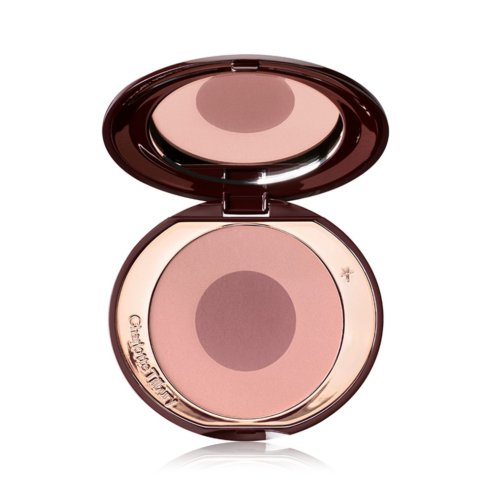 An open, mirrored-lid, duo-shade powder blush compact in tawny-rose.