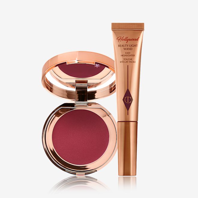 Multi-Use Makeup Magic Kit displayed A berry-pink lip and cheek cream tint compact with a mirrored-lid with a highlighter wand in bronze-gold packaging.