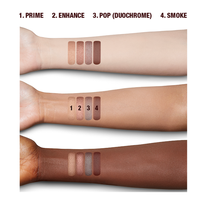 Luxury Palette of Pearls in Cosmic Pearl arm swatches Fair, tan, and deep-tone arms with swatches of matte and shimmery eyeshadows in shades of peachy-pink, dusky rose, warm burgundy, and teal blue-brown.