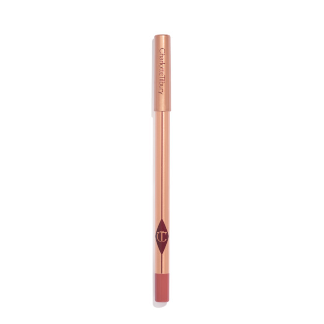 A warm, berry-pink lip liner with a golden-coloured body with nude-pink box packaging. 