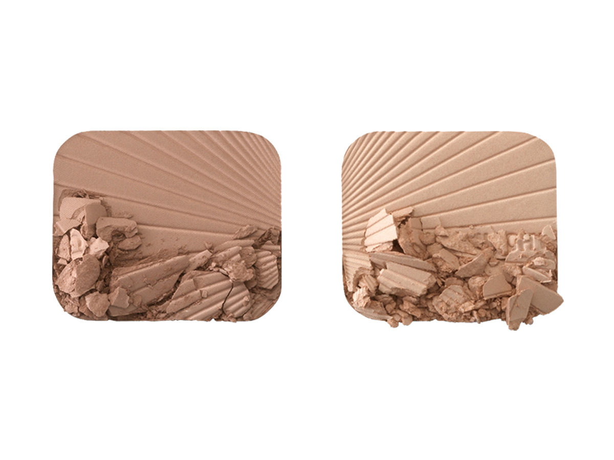 Swatches of a glowy, duo powder contour palette for light to medium skin tones.