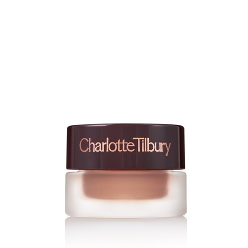 A closed pot of shimmering nude cream eyeshadow with a black-coloured lid with the CT logo on it.