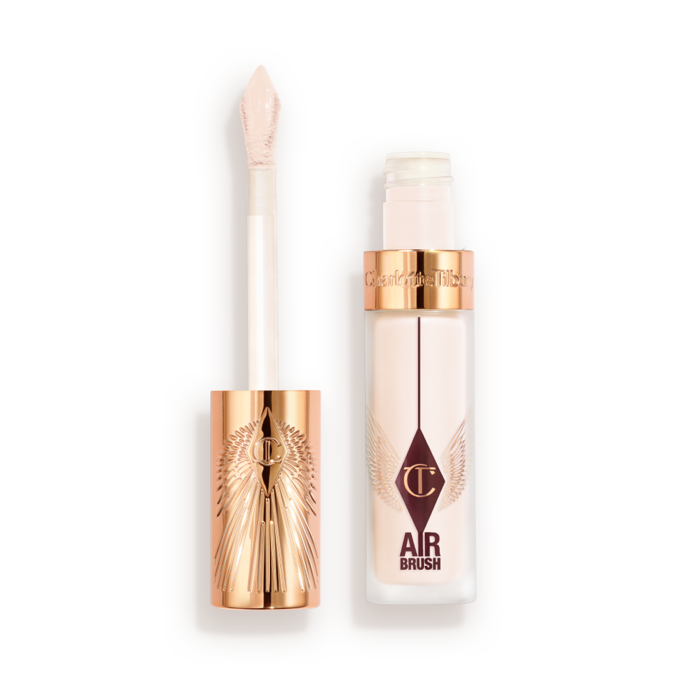 Charlotte Tilbury Airbrush Flawless Concealer with rose-gold cap and doe-foot applicator, shown with the lid off and product visible in a frosted tube.