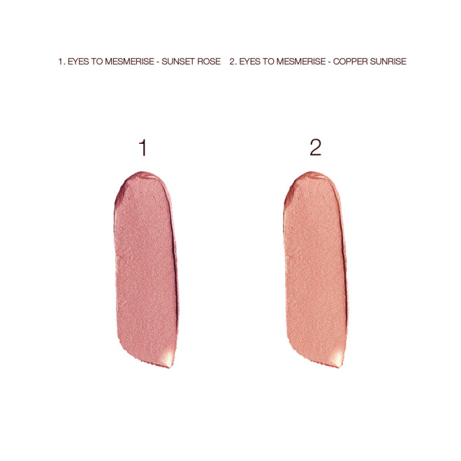 Swatches of two, glowy cream eyeshadows in dusky rose gold and coppery-champagne colours. 