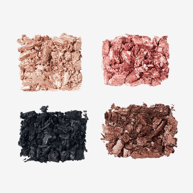 Hollywood Flawless Eye Filter in Diva Lights swatches Swatches of matte and shimmery eyeshadows in rose gold, chocolate brown, champagne, and black.