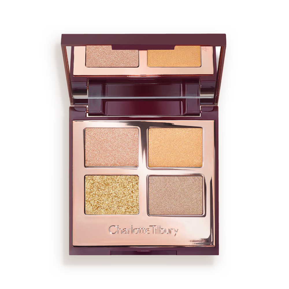 An open, mirrored-lid quad eyeshadow palette with four shimmery shades in champagne, soft gold, coppery-gold and soft bronze.