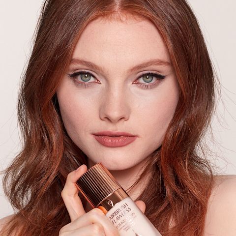 Model wearing Airbrush Flawless Foundation to create a full-coverage makeup look