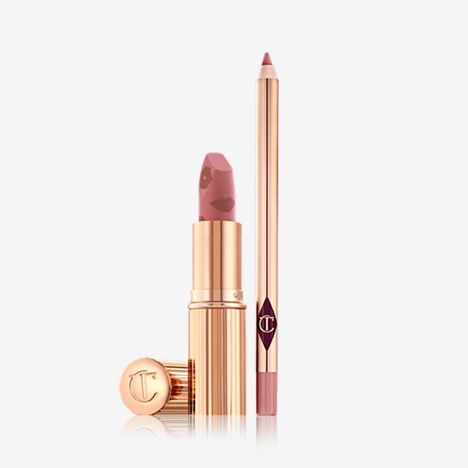 Luscious Lip Slick in Wedding Belles open An open matte lipstick in a dusty pink shade with an open lip liner pencil in a nude pink shade.