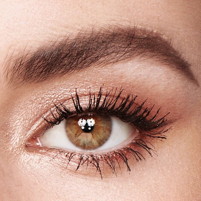 Model wearing a Christmas makeup look using the Exagger-Eyes Palette