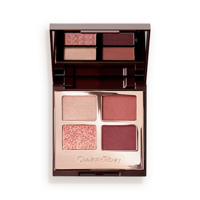 Luxury Palette Eyeshadow in Walk of No Shame open An open, mirrored-lid eyeshadow palette in shades of rose gold, champagne, maroon, and redwood.