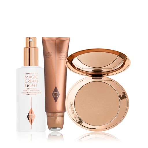 A face cream in a white-coloured bottle with a pump dispenser, body highlighter in a bronze-coloured tube, and a pressed-powder compact with a mirrored-lid. 