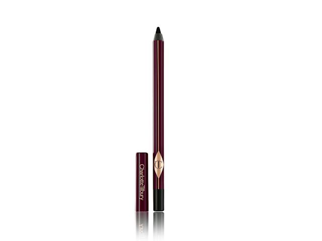 An open kohl liner in a black shade with dark crimson-coloured packaging and its cap next to it. 