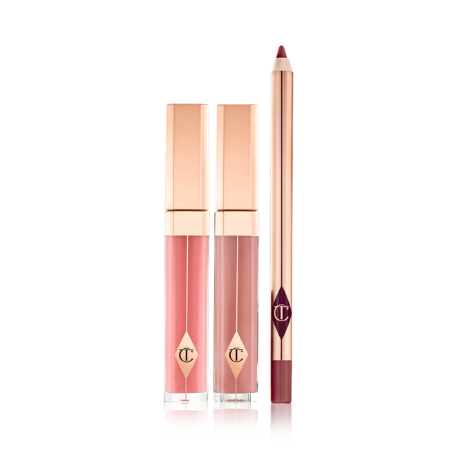 Tow lip glosses in gold-coloured packaging in a nude pink and mauve shades with a lip liner pencil in a maroon shade.