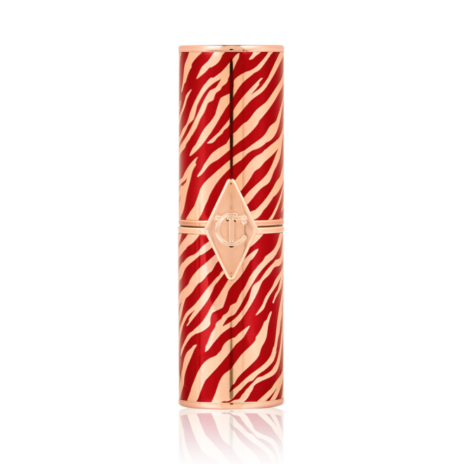 A closed lipstick in a gold-coloured tube with red flares all across, symbolic of the lunar new year, along with the CT logo embossed on the front. 