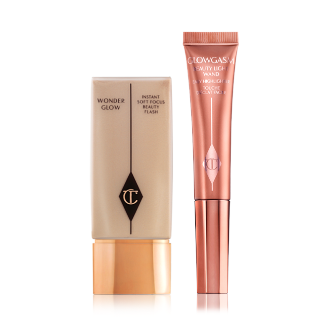 Glowy primer in a clear, rectangular body with a gold-coloured lid and a highlighter blush wand in glowy, medium pink shade. 