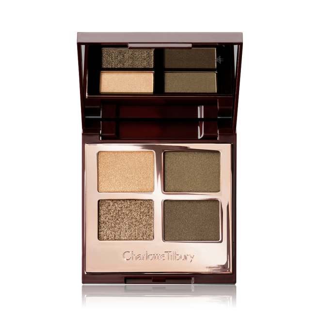 An open, quad eyeshadow palette in rose gold, metallic packaging with a mirrored lid having dark green, olive green, khaki, and golden eyeshadows. 