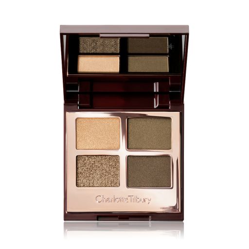 An open, quad eyeshadow palette in rose gold, metallic packaging with a mirrored lid having dark green, olive green, khaki, and golden eyeshadows. 