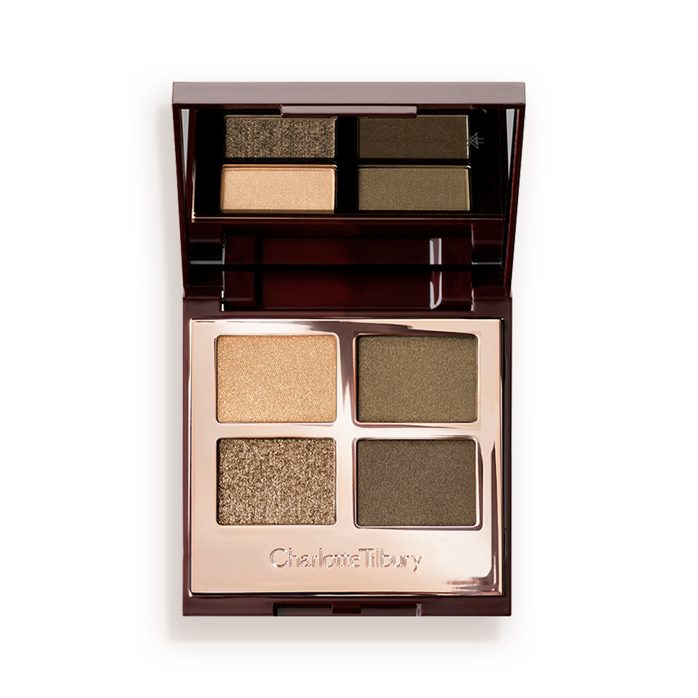 An open, quad eyeshadow palette in rose gold, metallic packaging with a mirrored lid having dark green, olive green, khaki, and golden eyeshadows. 