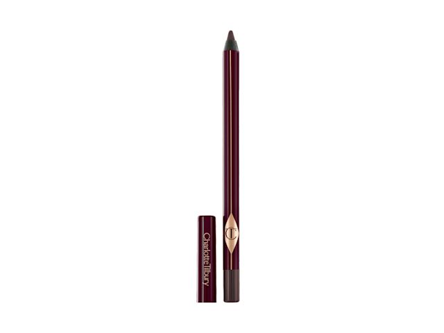 An open, dark brown kohl eyeliner pencil with its lid next to it.