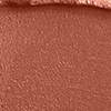 Close-up swatch of a sultry rose-brown nude lipstick with a matte finish.