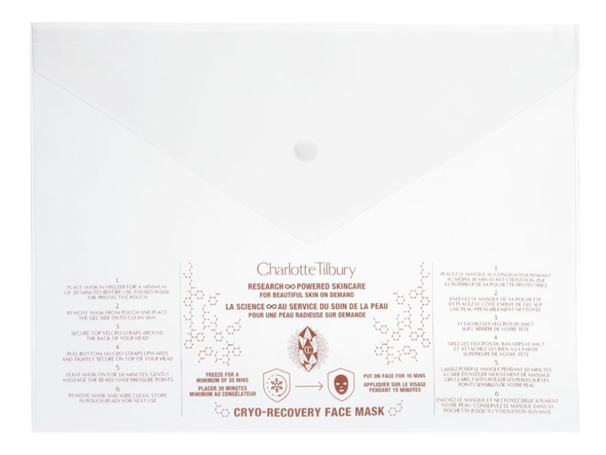 A white-coloured face mask outer packaging in the shape of a large envelope.