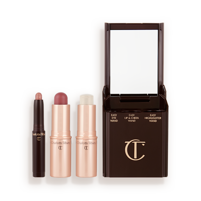 Quick & Easy Instant 5 Minute Sun-Kissed Look Kit products displayed An open shadow stick in a sunset, sultry pink shade, a lip and cheek blush stick in a soft pink colour, and highlighter stick in an opal shade.