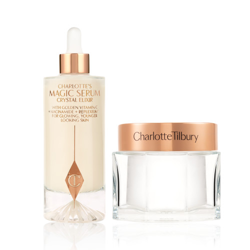 A large serum in a glass bottle with a golden and white-coloured dropper lid and pearly-white face cream in a glass jar with a rose-gold-coloured lid. 