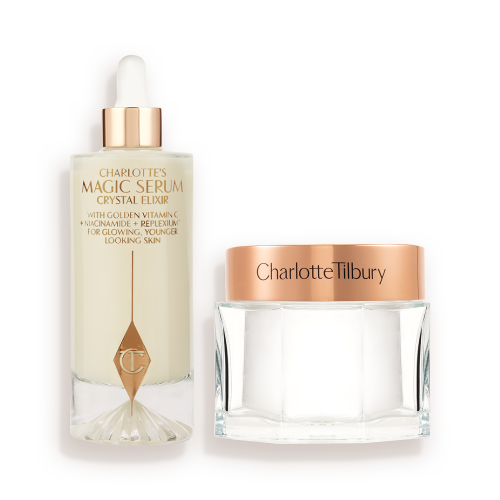 A large serum in a glass bottle with a golden and white-coloured dropper lid and pearly-white face cream in a glass jar with a rose-gold-coloured lid. 