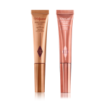 A highlighter wand and a highlighter blush wand with reflective packaging in rose gold and honey-gold shades.