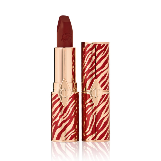 Two lipsticks, one with its lid and one without, in delicate bright berry colour with a matte finish. 