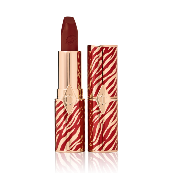 Two lipsticks, one with its lid and one without, in delicate bright berry colour with a matte finish. 