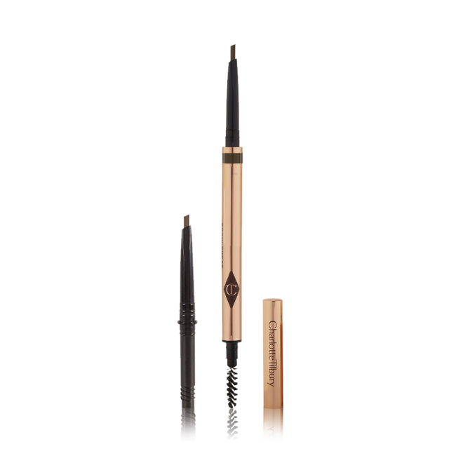 A double-ended eyebrow pencil and spoolie brush duo in a natural brown shade with gold-coloured packaging and the refill besides it.