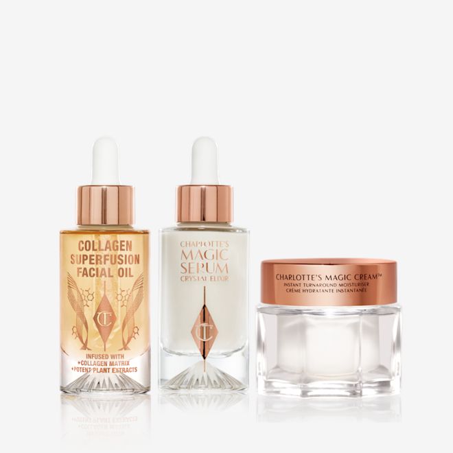 Magic Collagen 3-step Kit A light-gold-coloured facial oil in a glass bottle with a gold and white-coloured dropper lid, luminous, ivory-coloured facial serum in a glass bottle with a white and gold-coloured dropper lid, and pearly-white face cream in a glass jar with a gold-coloured lid.
