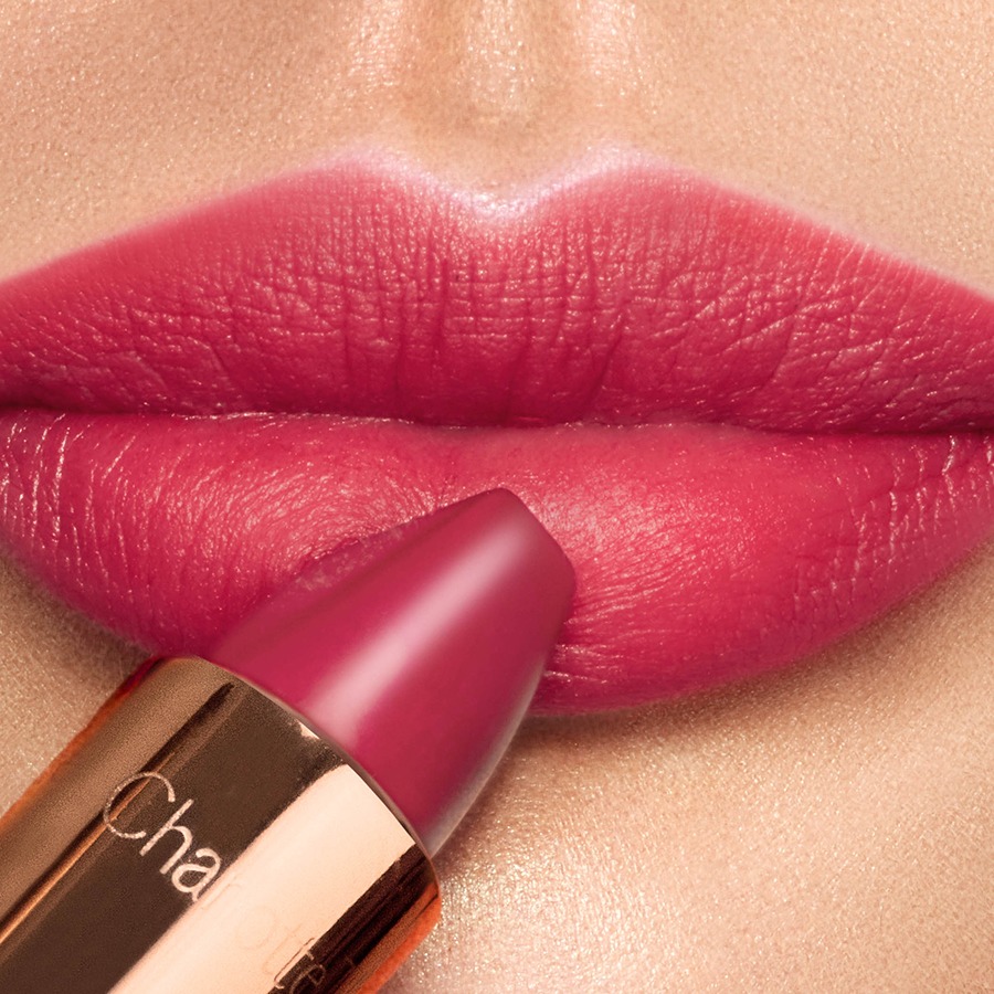 Close up of model wearing Matte Revolution in Gracefully Pink, a vivid pink lipstick